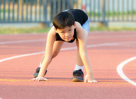 photo of a boy getting ready to run a race