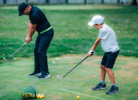 Boy learning to golf
