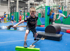 Boy racing an obstacle course